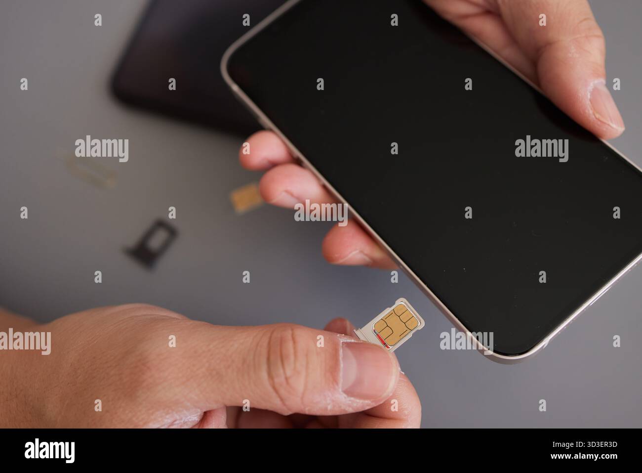 SIM card replacement in the phone Stock Photo