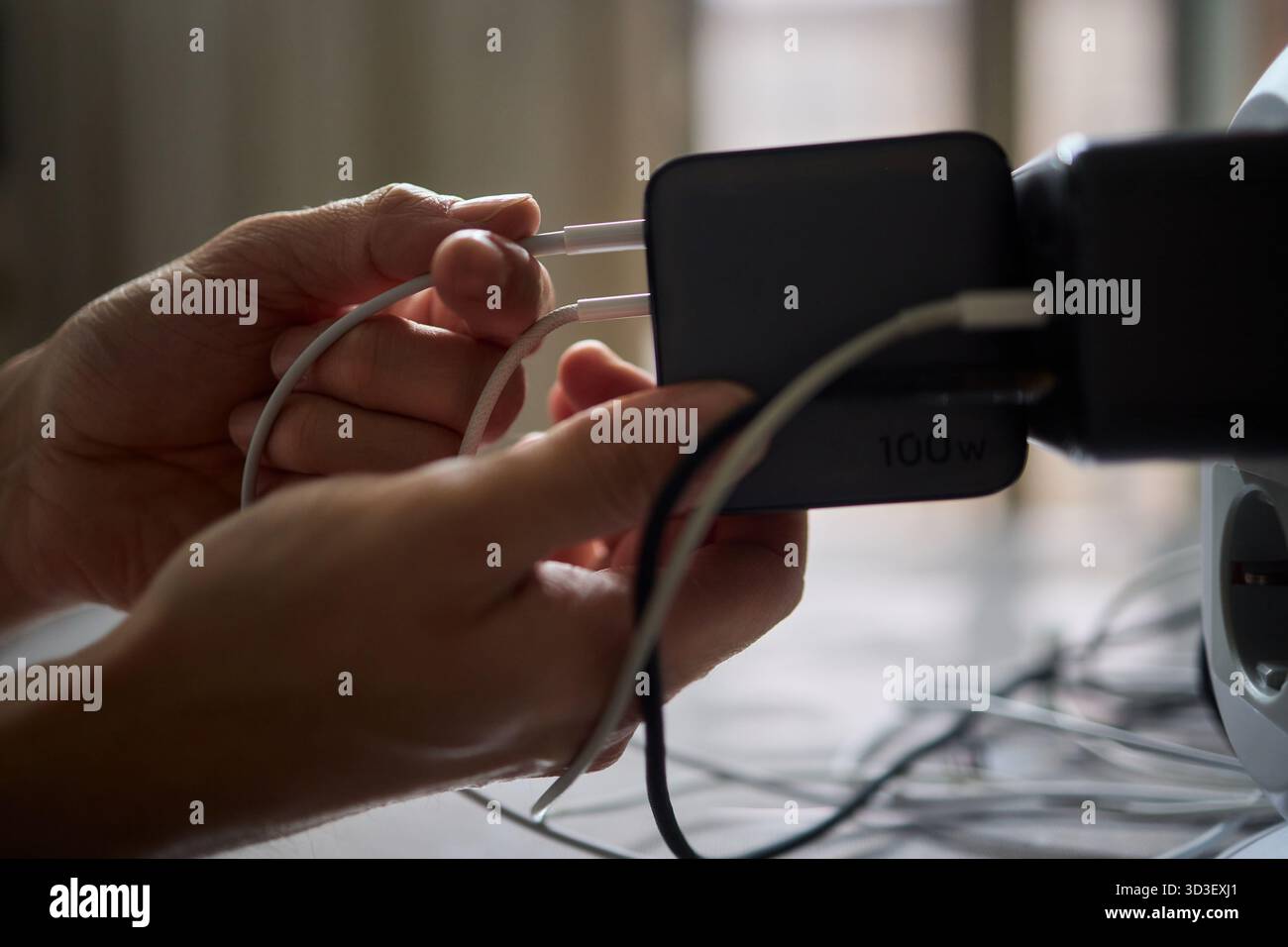Charging devices that feature multiple ports and connectors for versatile connectivity Stock Photo