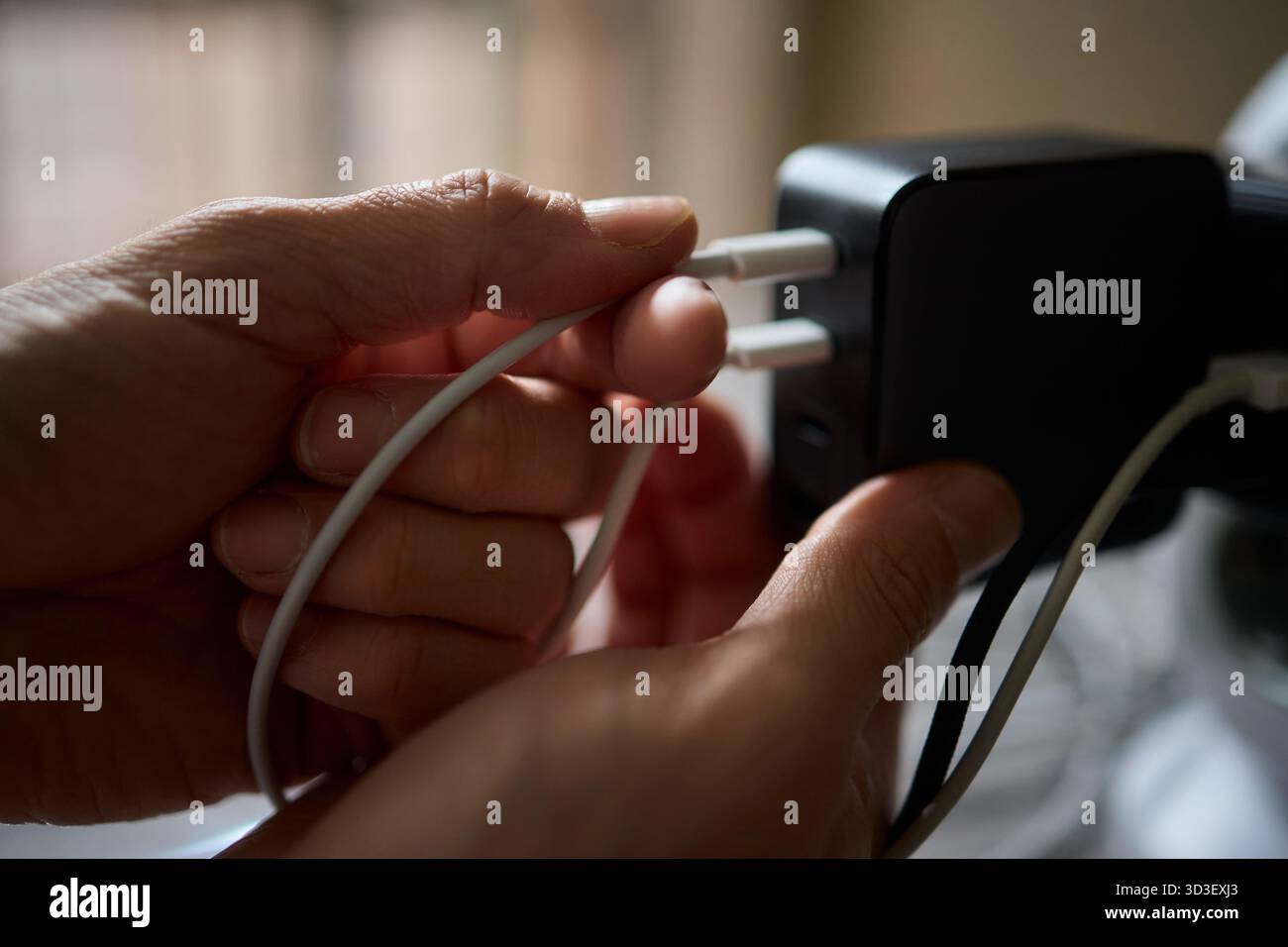 Charging devices that feature multiple ports and connectors for versatile connectivity Stock Photo