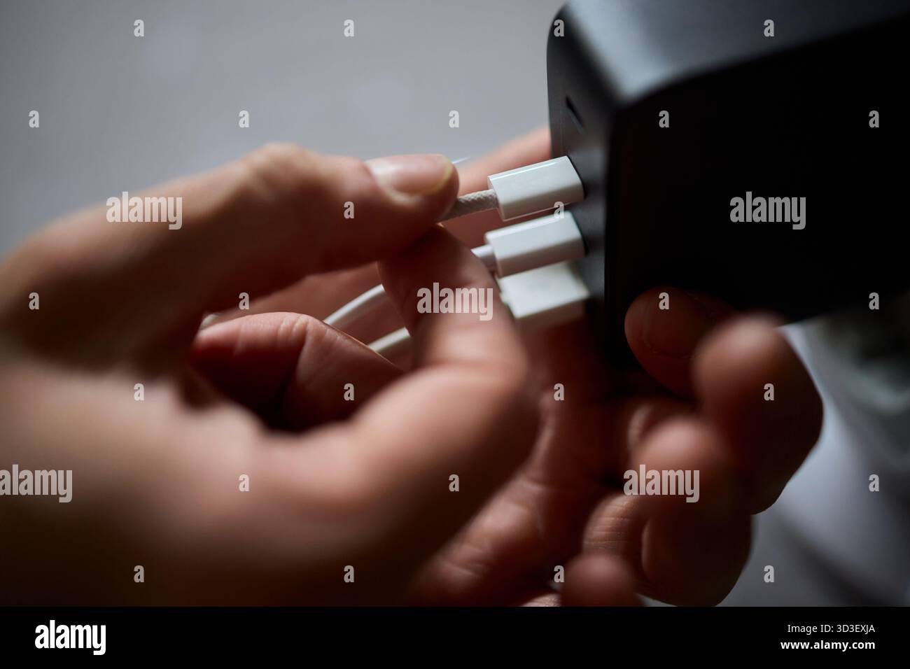 Charging devices that feature multiple ports and connectors for versatile connectivity Stock Photo