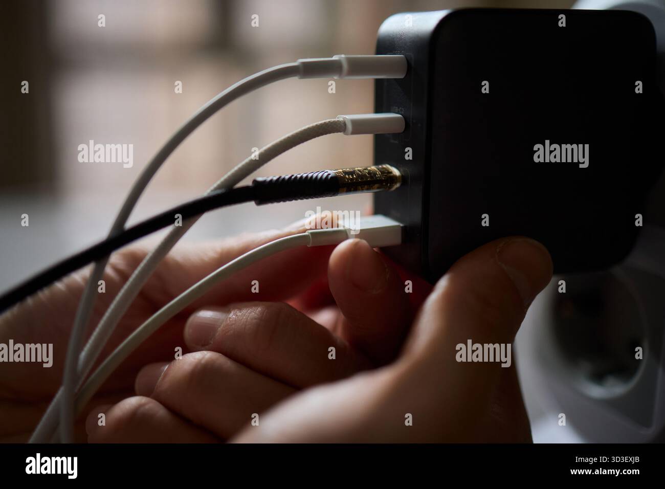 Charging devices that feature multiple ports and connectors for versatile connectivity Stock Photo