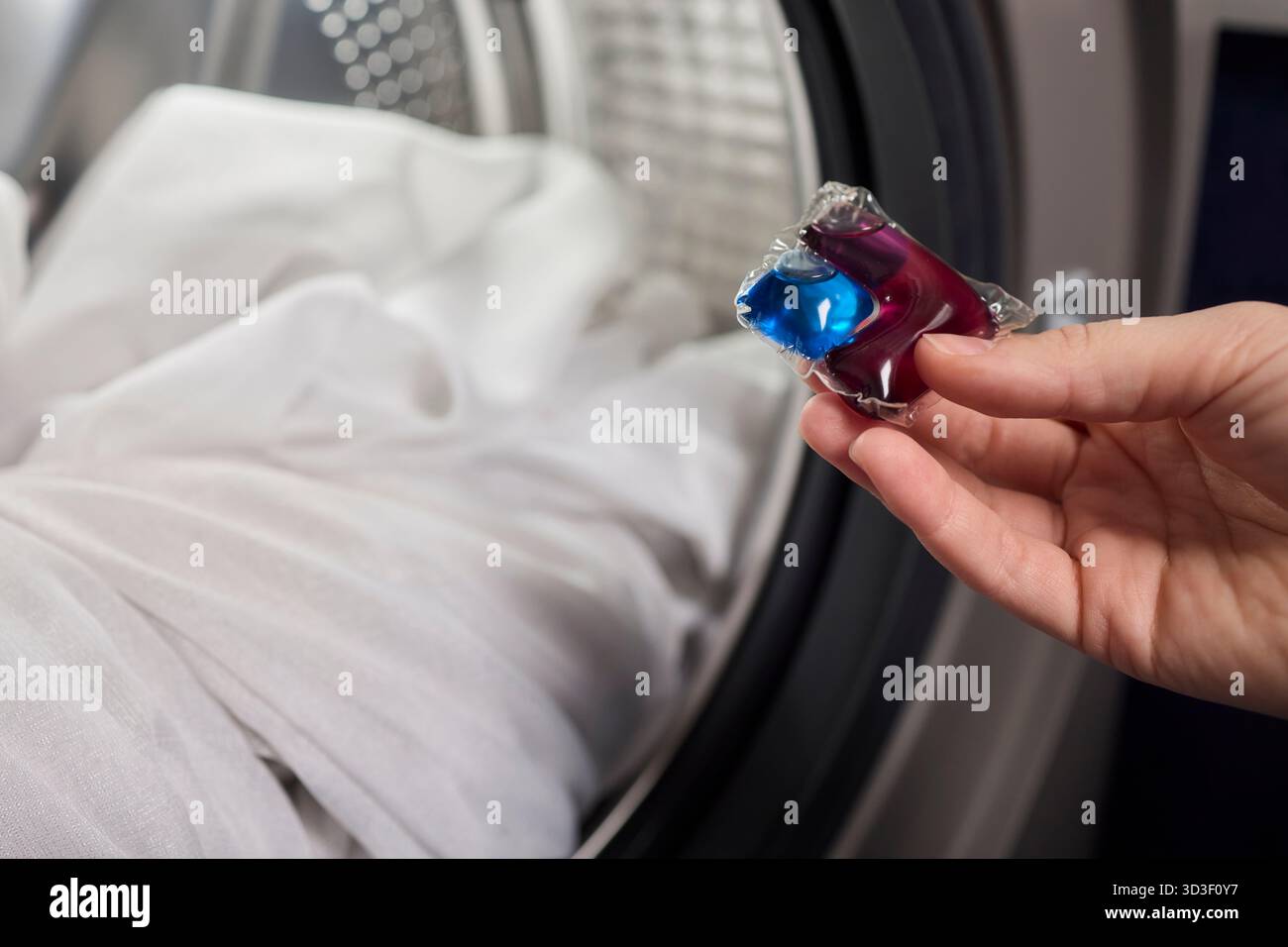 Using Laundry Detergent Pods While Doing Laundry in the Washing Machine ...