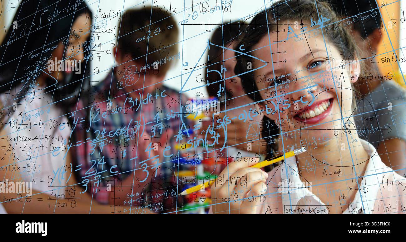Smiling teen girl holding yellow pencil writing math equations on glass board in class, copy space Stock Photo