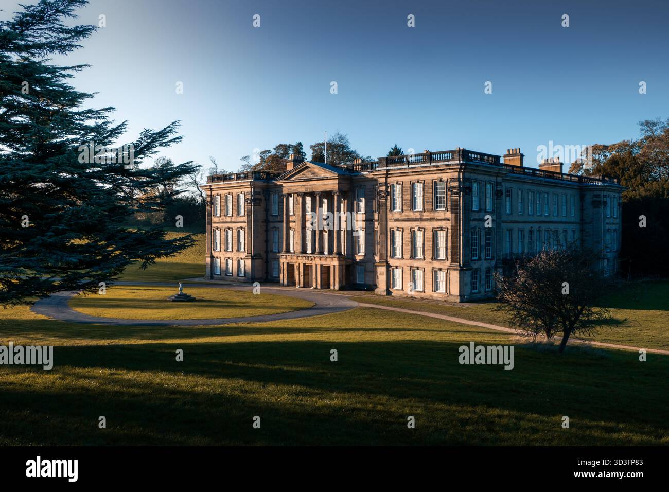 Historic English country house surrounded by parkland, photographed in ...