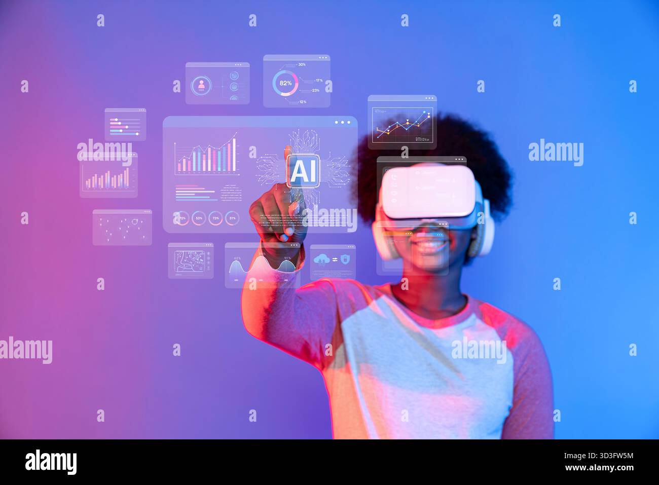 A young user wearing a virtual reality headset interacts with AI-driven data analytics and visualizations in a futuristic digital workspace Stock Photo