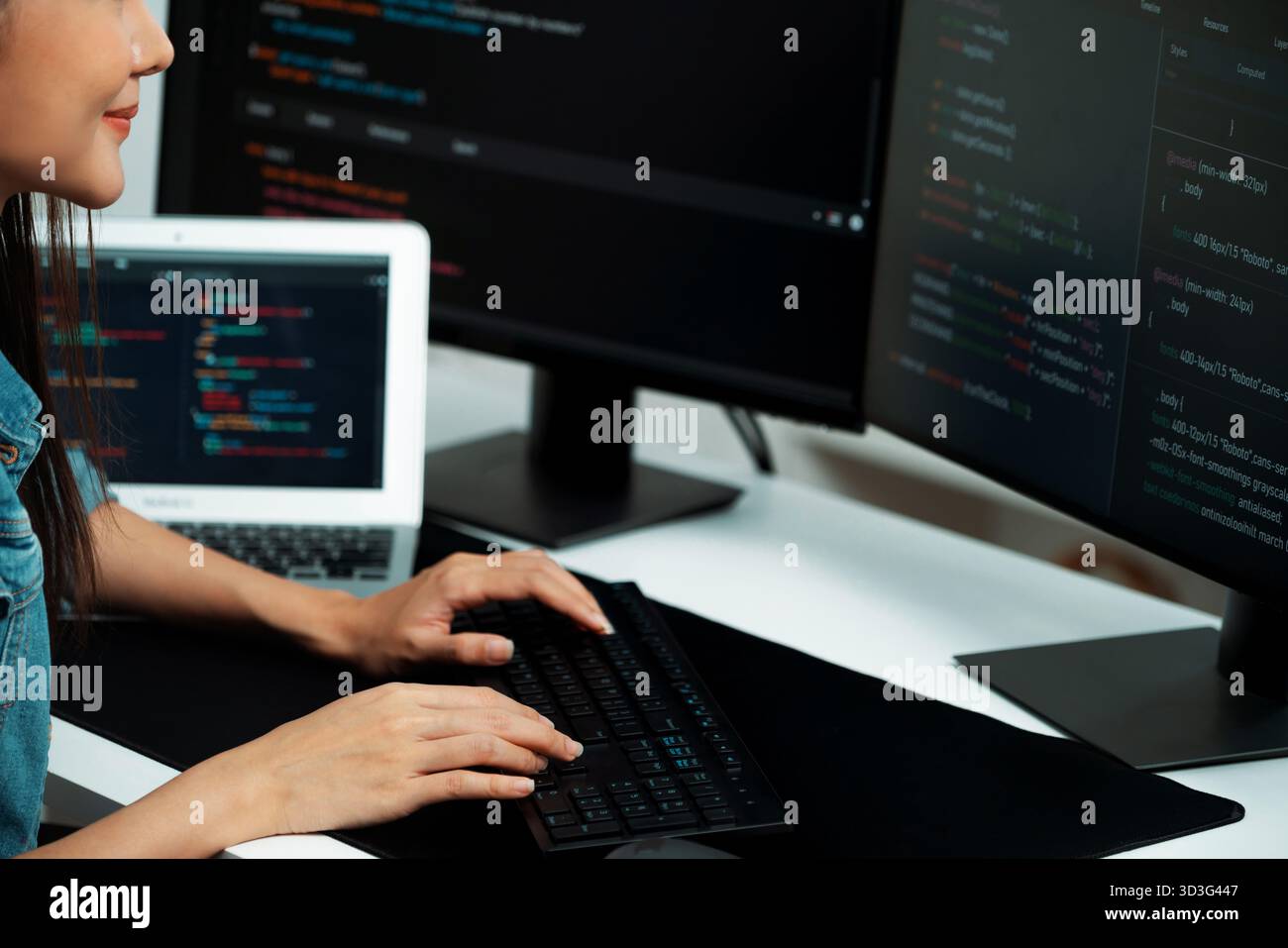 Cropped hands image of IT developer creating with typing information on pc with coding program information data website application, wearing jeans Stock Photo