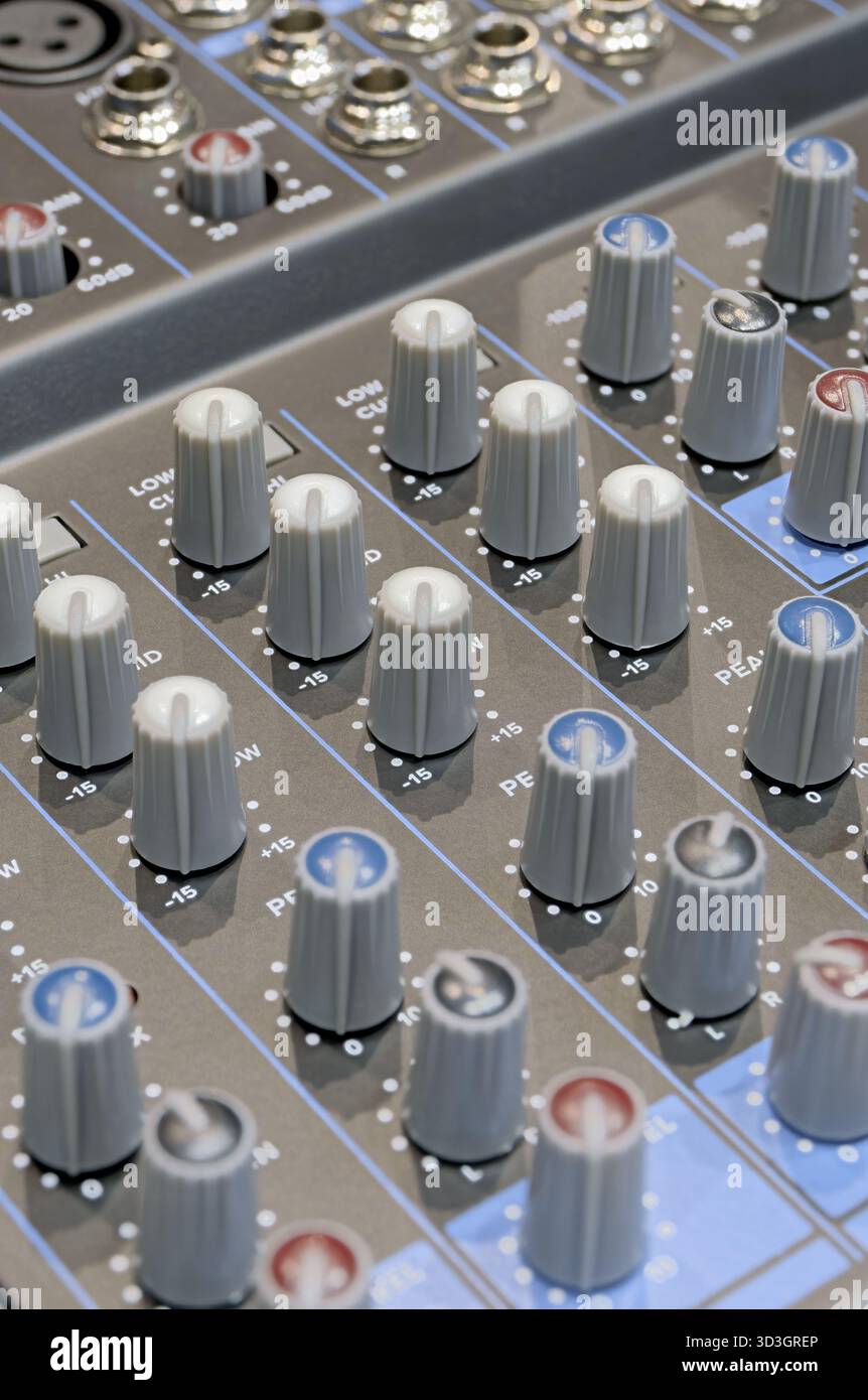 Generic audio mixing console, close up shot, abstract technology background Stock Photo