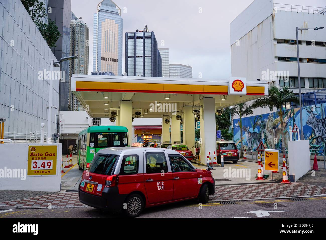 A taxi driving into a Shell gas station on November 6, 2025 in Hong ...