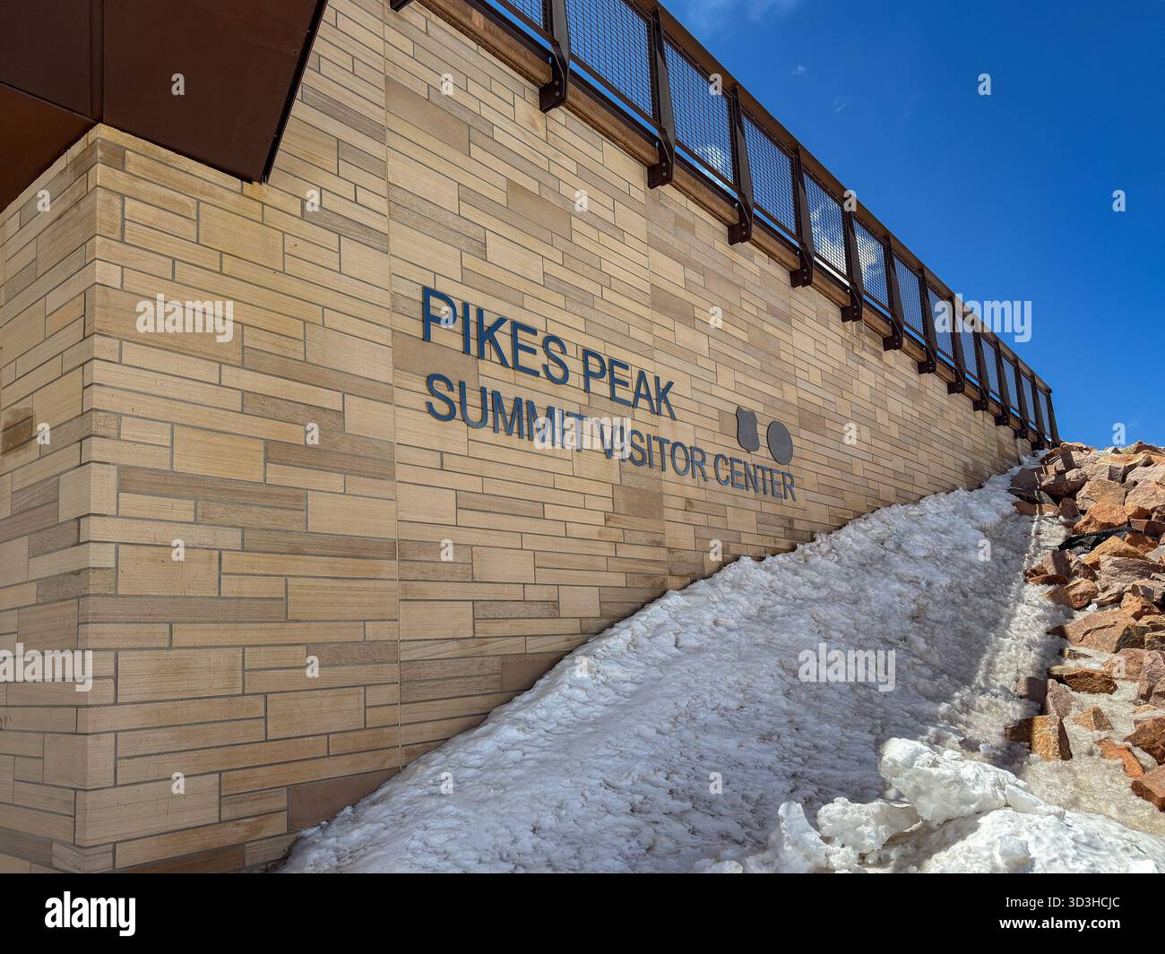 Manitou Springs, Colorado, USA - 21 May 2025: Exterior view of the Visitor Center at the summit of Pikes Peak with snow on the ground. - Smartphone Captured Stock Image