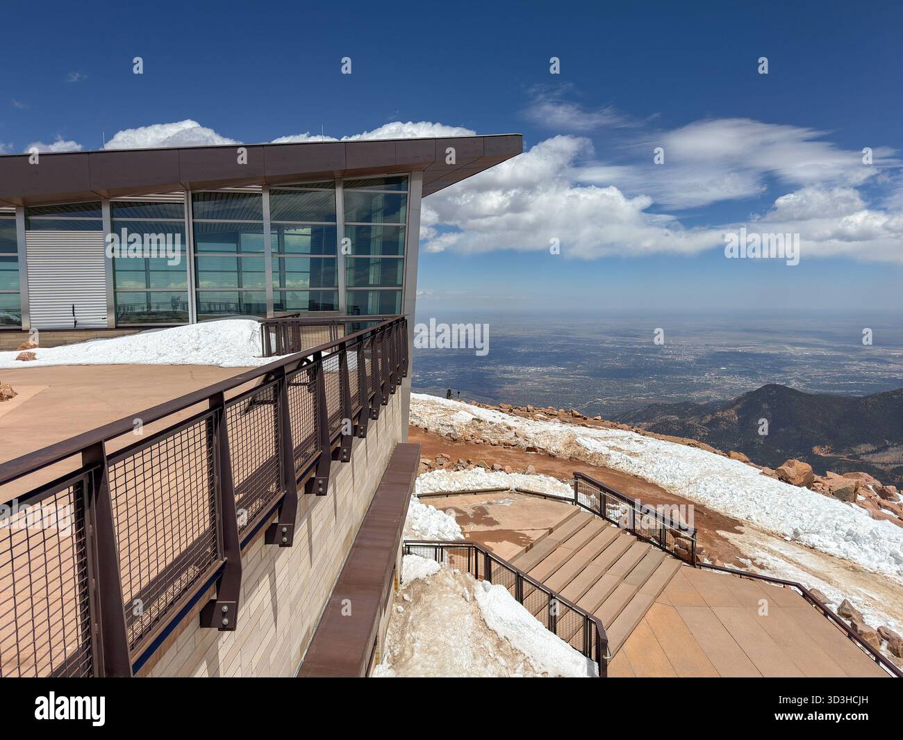 Manitou Springs, Colorado, USA - 21 May 2025: Scenic view of the Visitor Center at the summit of Pikes Peak with snow on the ground. - Smartphone Captured Stock Image