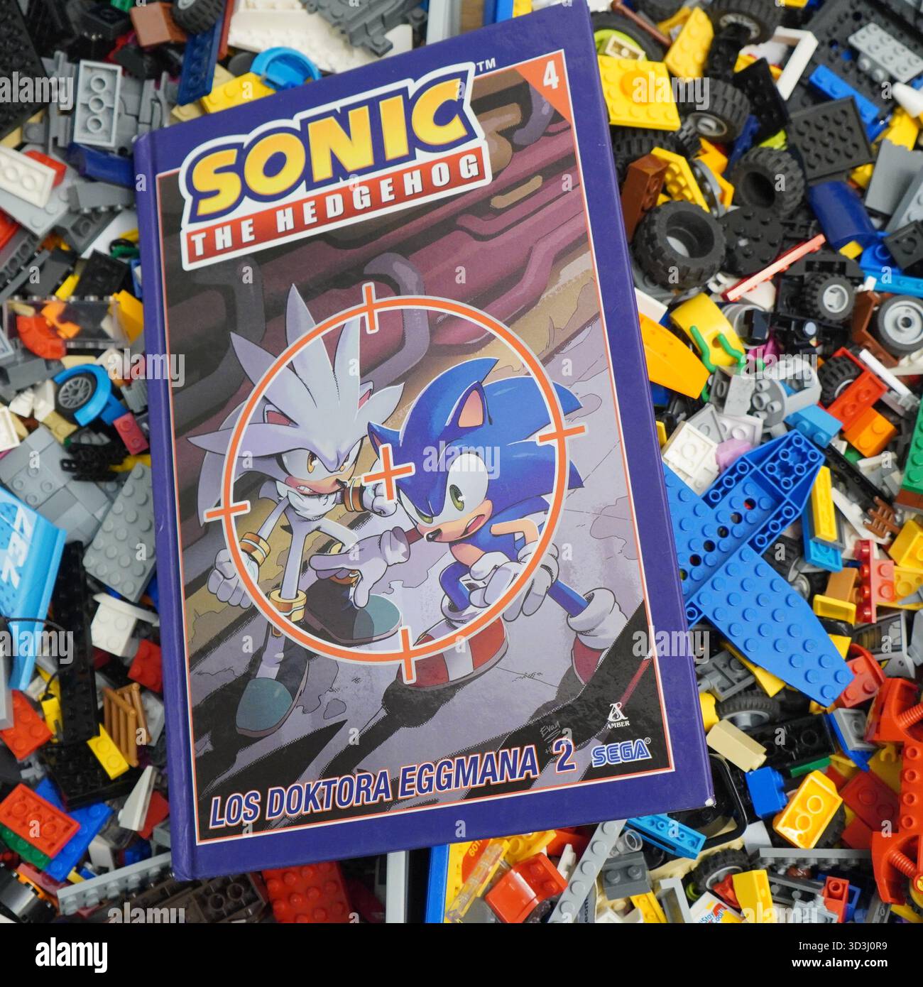 A book laying on Lego bricks Stock Photo