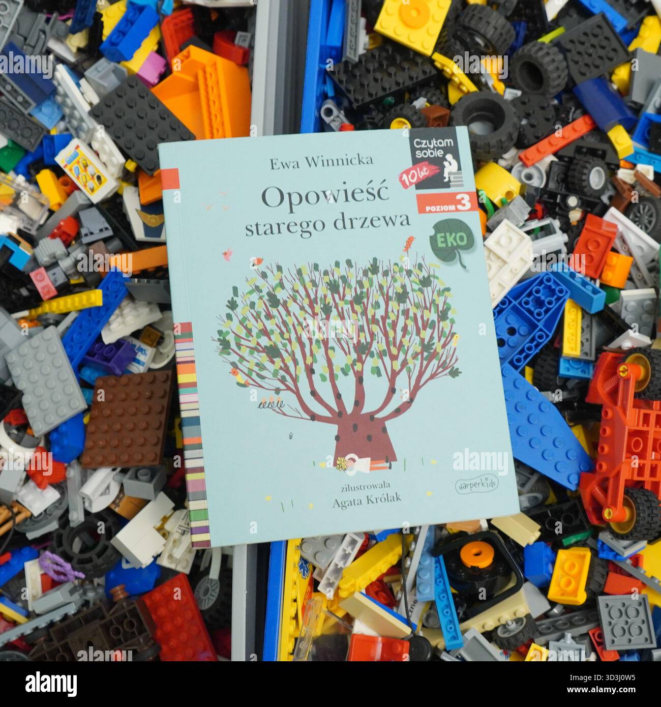 A book laying on Lego bricks Stock Photo