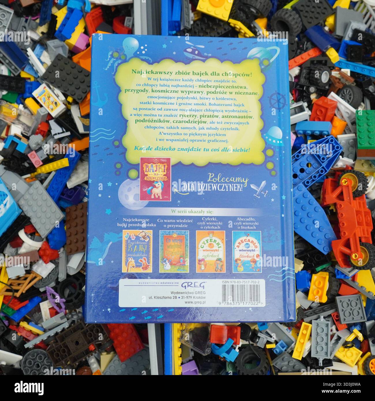 A book laying on Lego bricks Stock Photo
