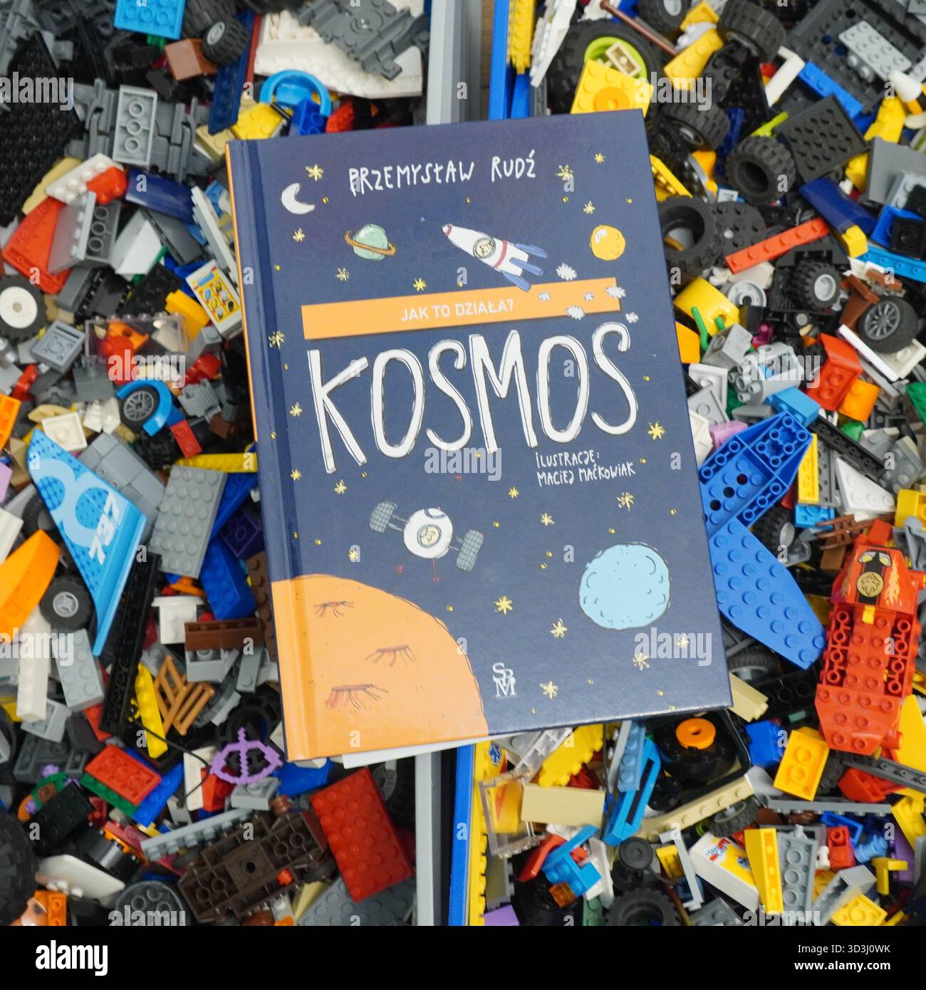 A book laying on Lego bricks Stock Photo