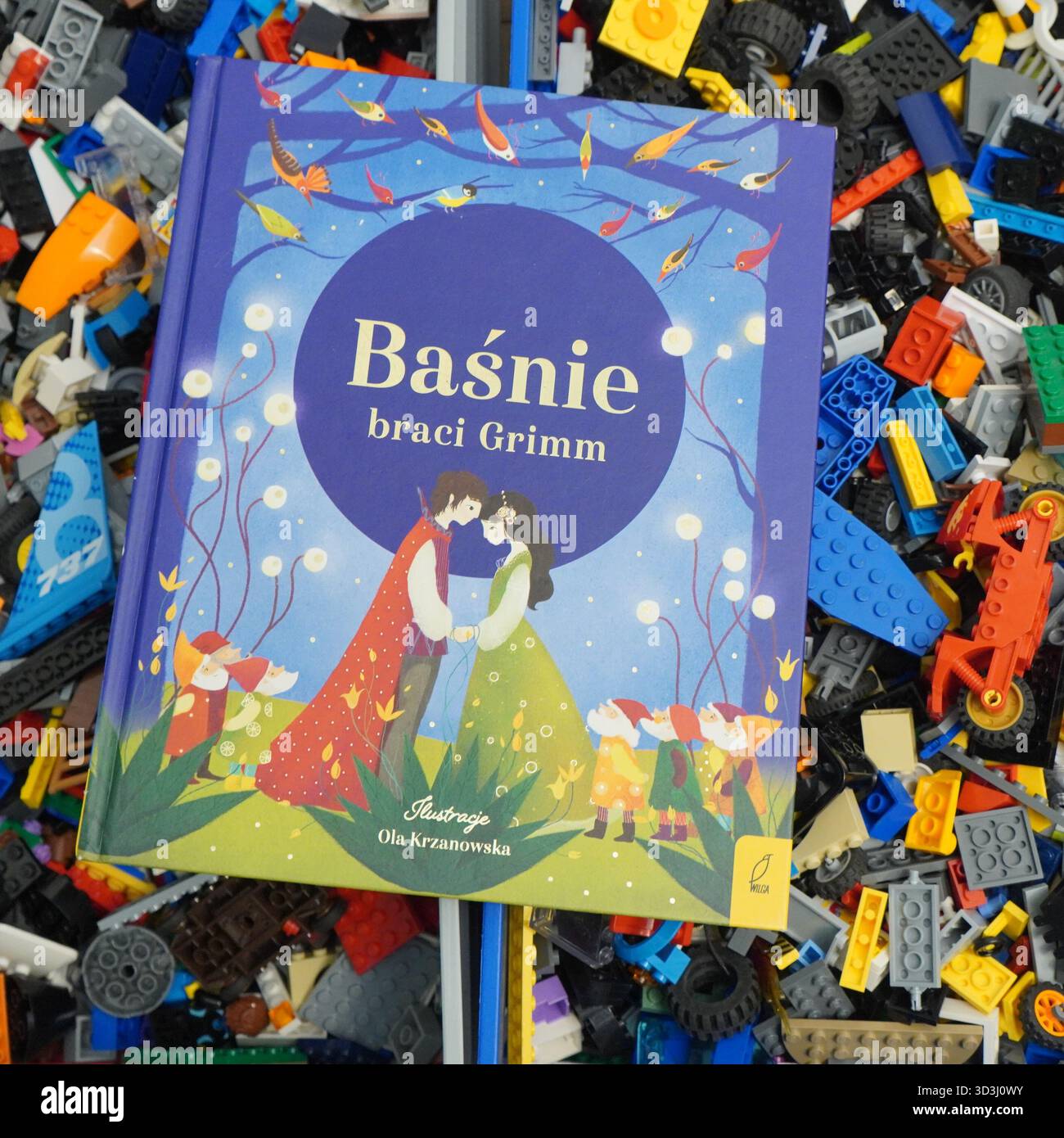 A book laying on Lego bricks Stock Photo