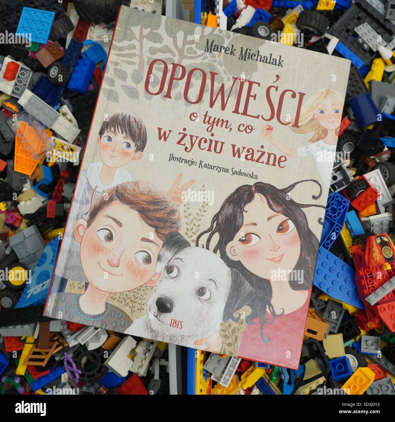 A book laying on Lego bricks Stock Photo