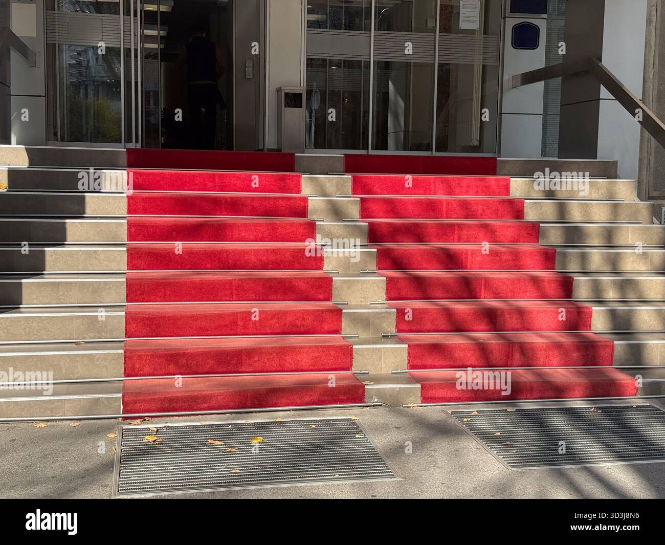 Entrance staircase with red carpet. Prestige, architecture, and modern ...