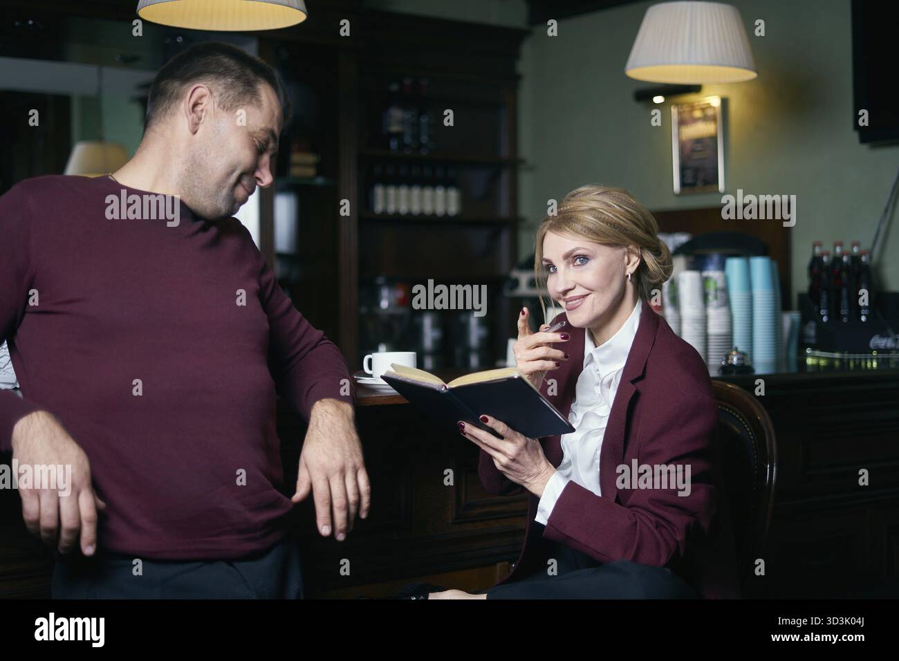 Business people talking over coffee in a cafe Stock Photo