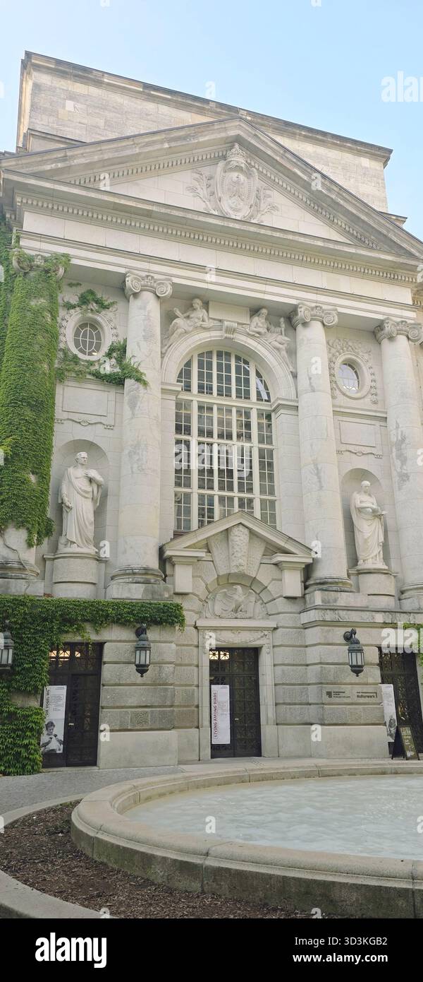 Berlin, Germany - June 02, 2025: Historic architecture features ivy-covered facade and intricate sculptures in sunlight. - Smartphone Captured Stock Image