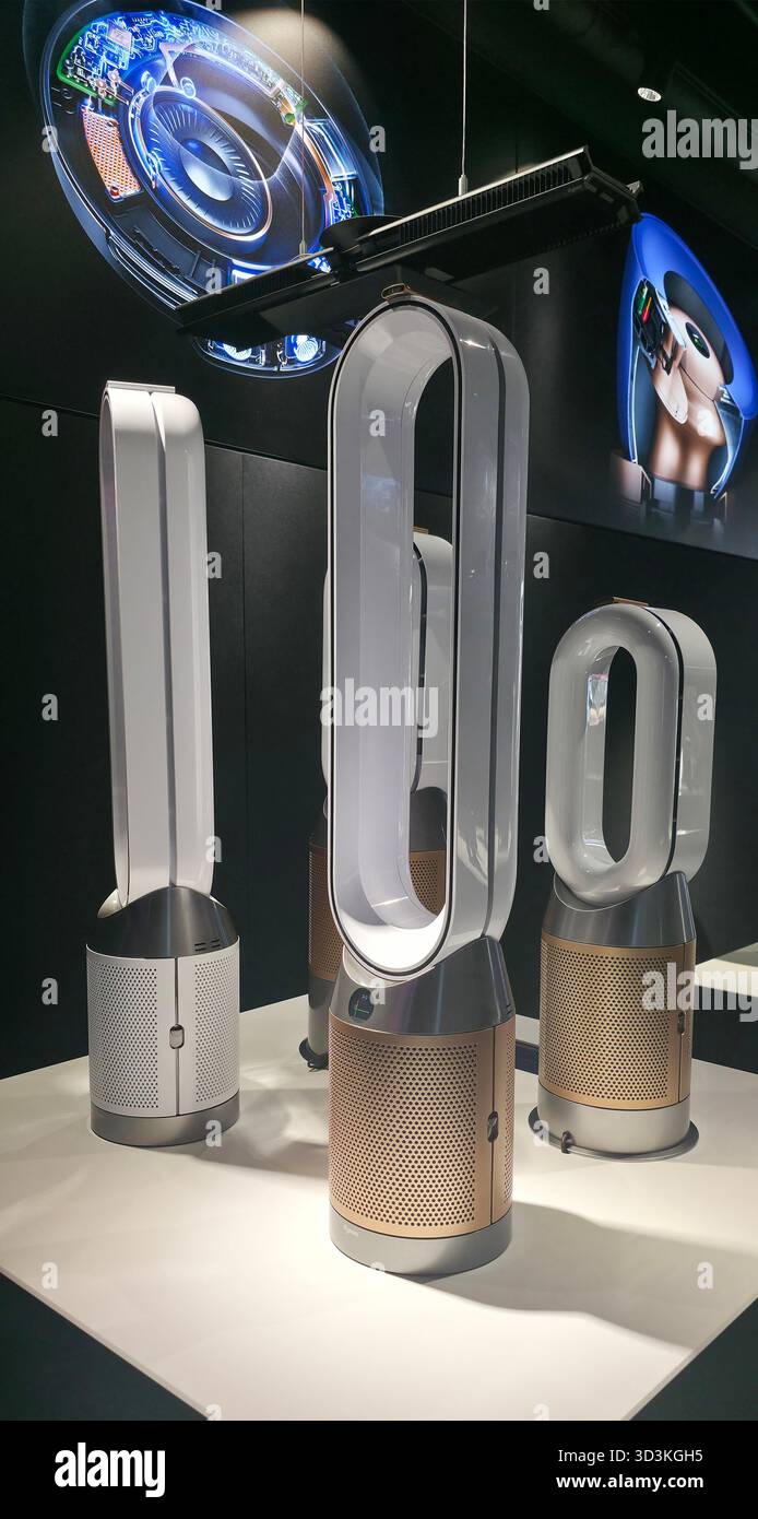 Berlin, Germany - June 17, 2025: Modern Dyson air purifiers showcased in a sleek showroom setting with elegant design. - Smartphone Captured Stock Image