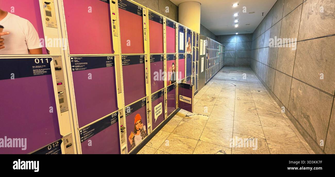 Berlin, Germany - July 14, 2025: Modern locker room features vibrant purple lockers and sleek design elements throughout the space. - Smartphone Captured Stock Image