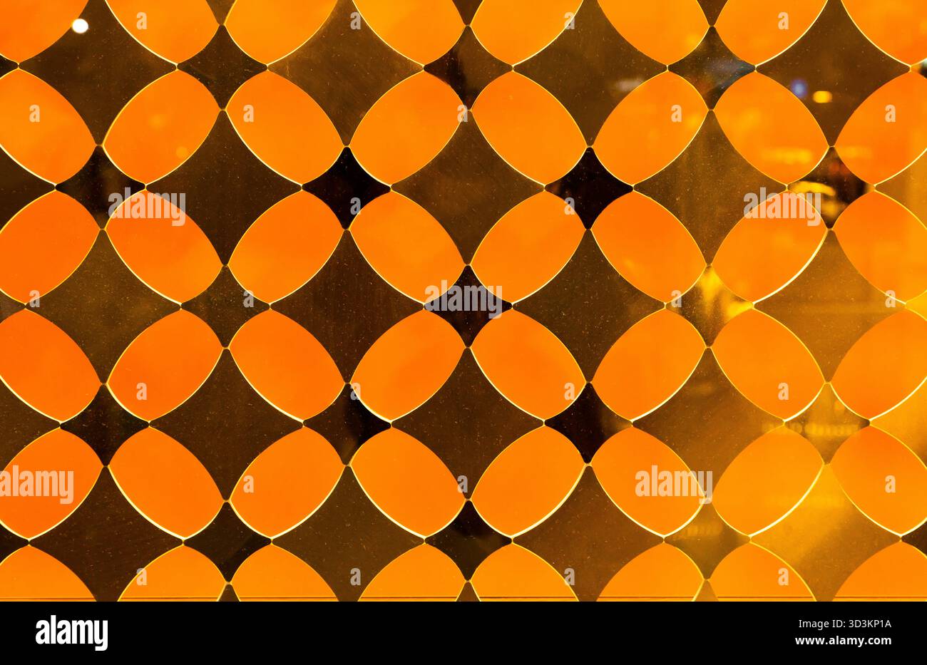 Yellow decorative translucent glass with a diamond pattern. Stock Photo