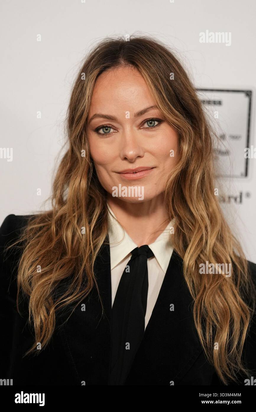 Olivia Wilde poses for photographers upon arrival at the Harper's Bazaar Women Of The Year event