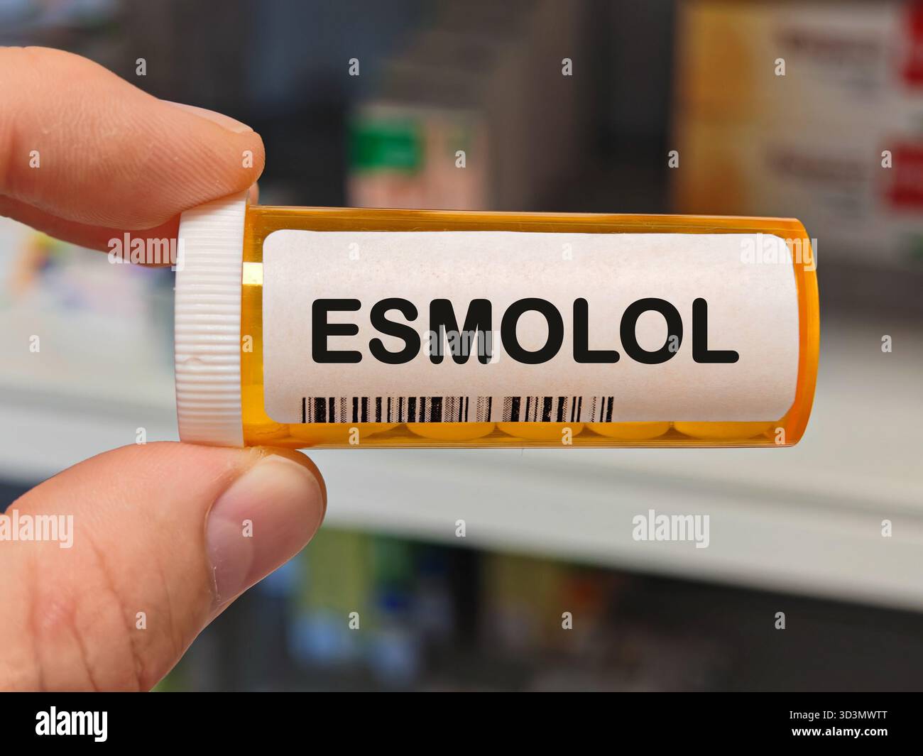 Spasmol orange plastic Box of ESMOLOL tablets on a hospital pharmacy table used ...
