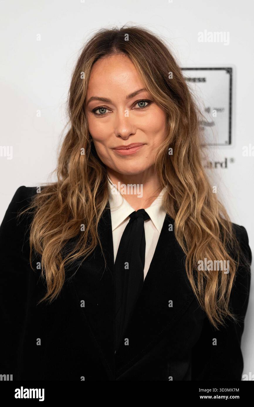 Olivia Wilde poses for photographers upon arrival at the Harper's Bazaar Women Of The Year event