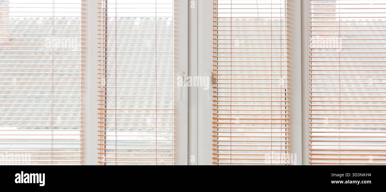 Big window with blinds in room Stock Photo