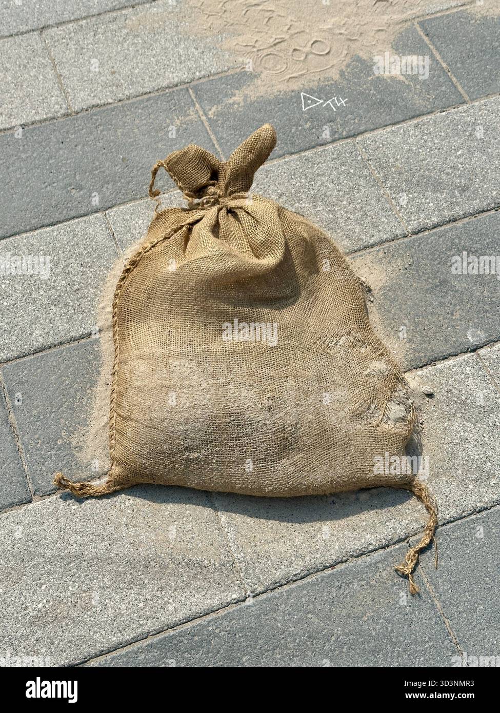 Sandbag on pavement - Smartphone Captured Stock Image