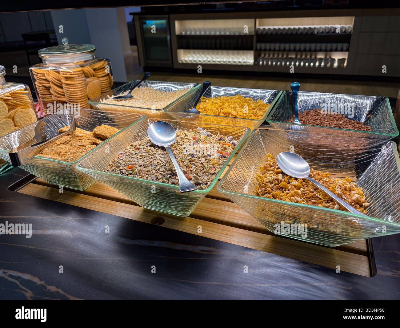 Buffet breakfast display featuring an assortment of cereals, muesli,  granola, and oats in clear glass bowls. Cookies and crackers are also  available i Stock Photo - Alamy, image size:1300x1065
