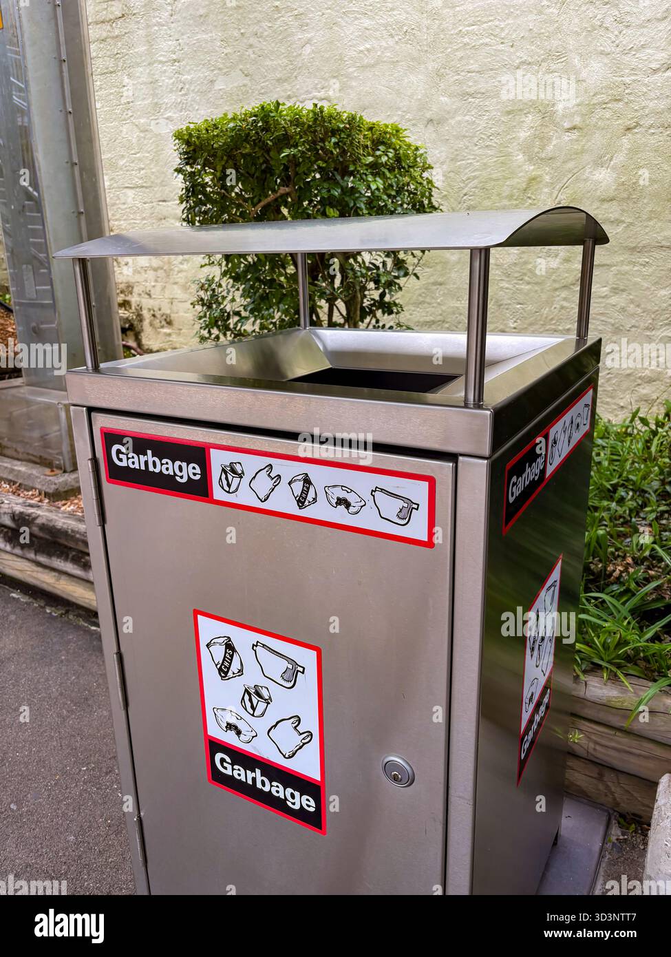 Modern stainless steel garbage bin with 'Garbage' labels and icons ...