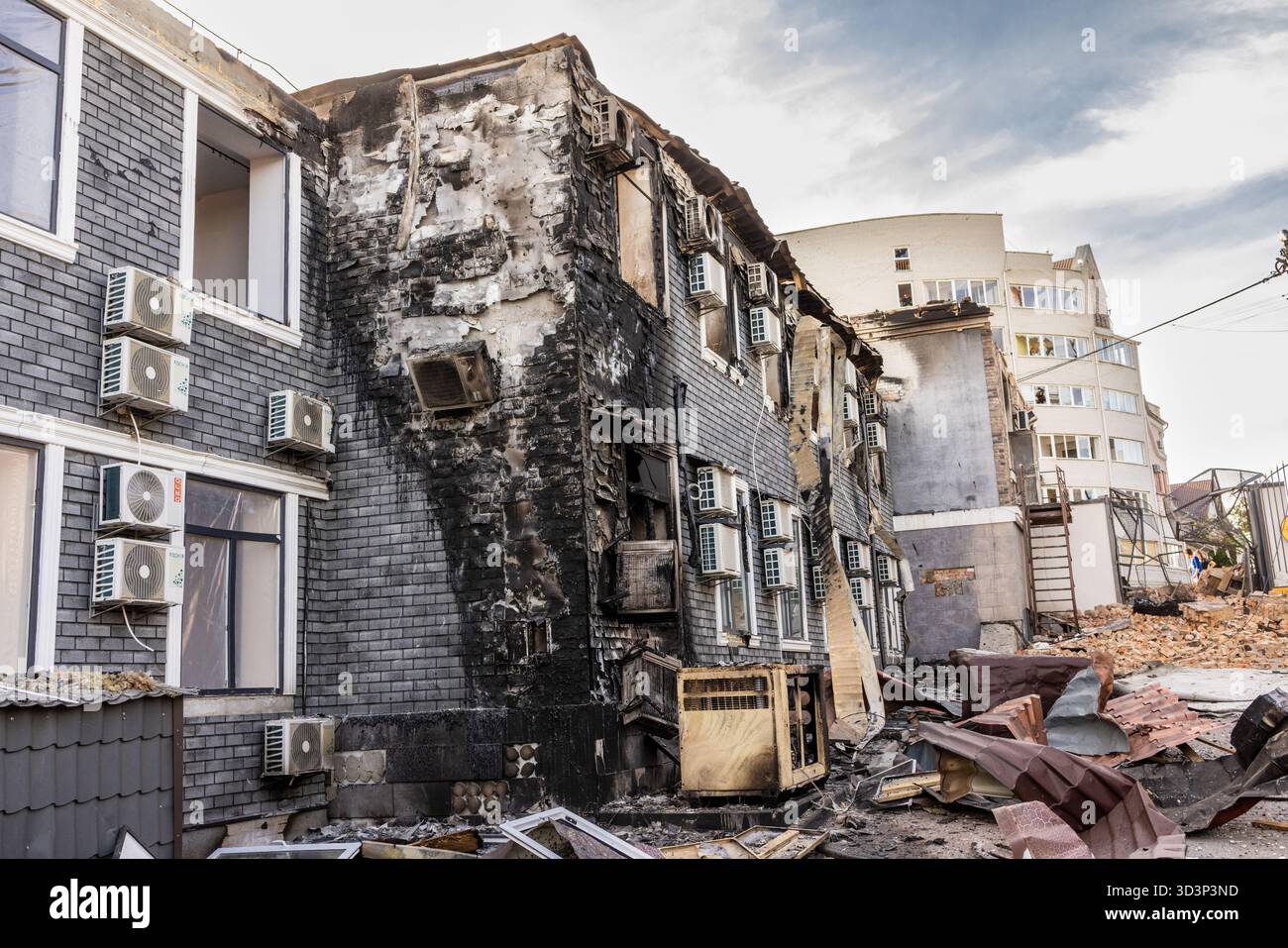 Aerial view of urban destruction partially intact buildings with AC ...