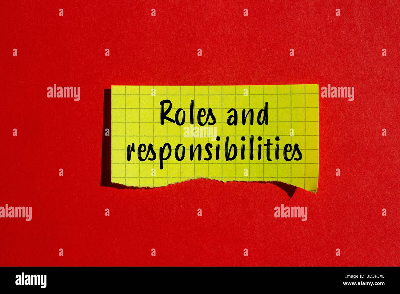 Roles and responsibilities message written on ripped torn paper ...