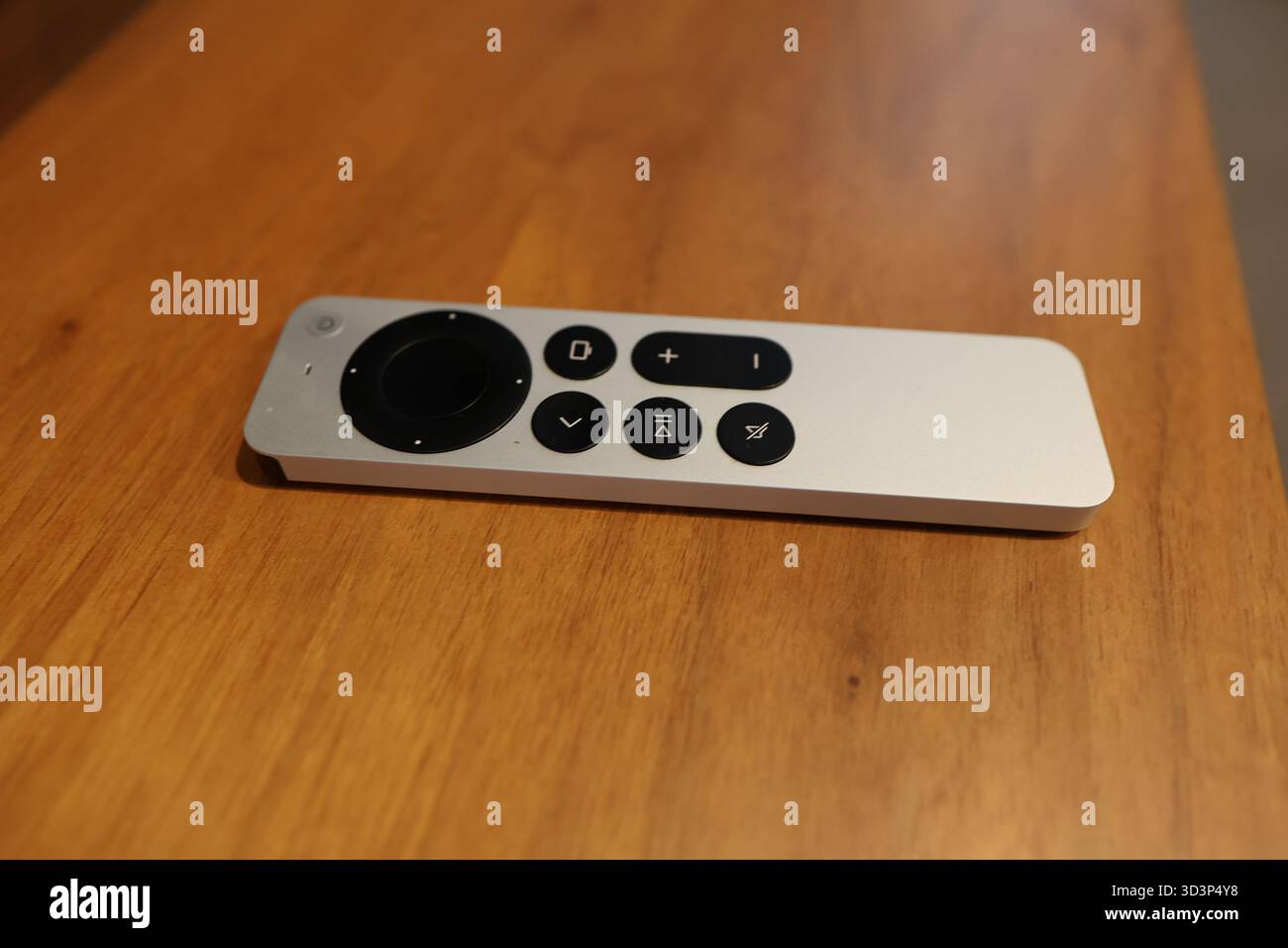 Modern remote control on wooden table Stock Photo