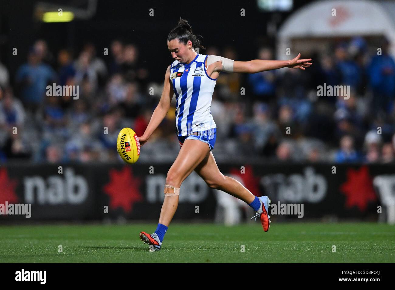 Blaithin Bogue of the Kangaroos kicks the footy during the AFLW ...