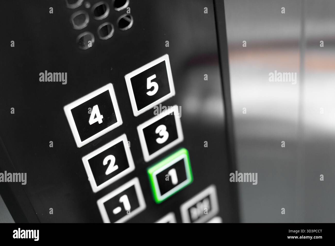 Elevator control panel showing pressed button in a modern building Stock Photo