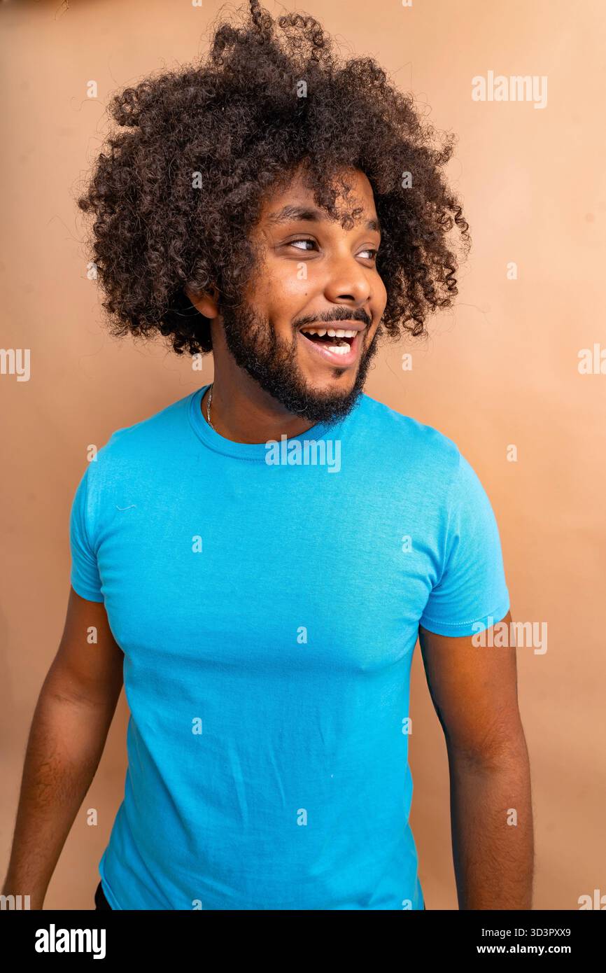 Black man wearing blue t-shirt laughing Stock Photo