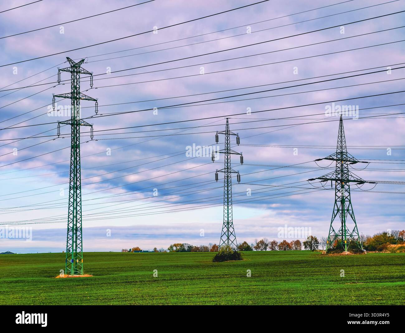 High Voltage Power Lines Transmission Towers Across Green Agricultural ...