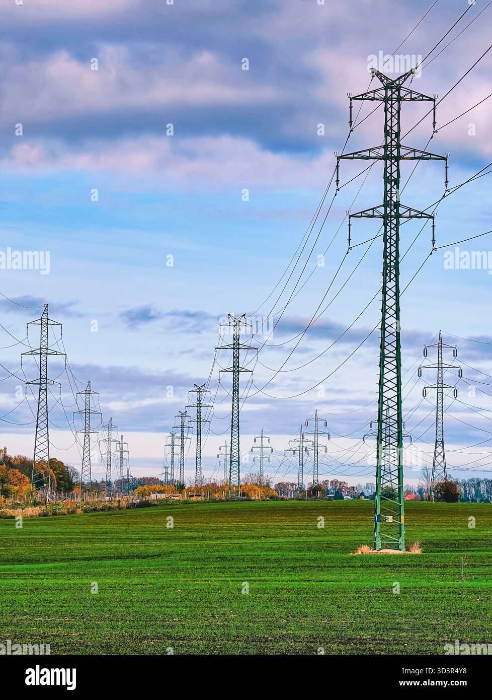 High Voltage Power Lines Transmission Towers Across Agricultural Field ...