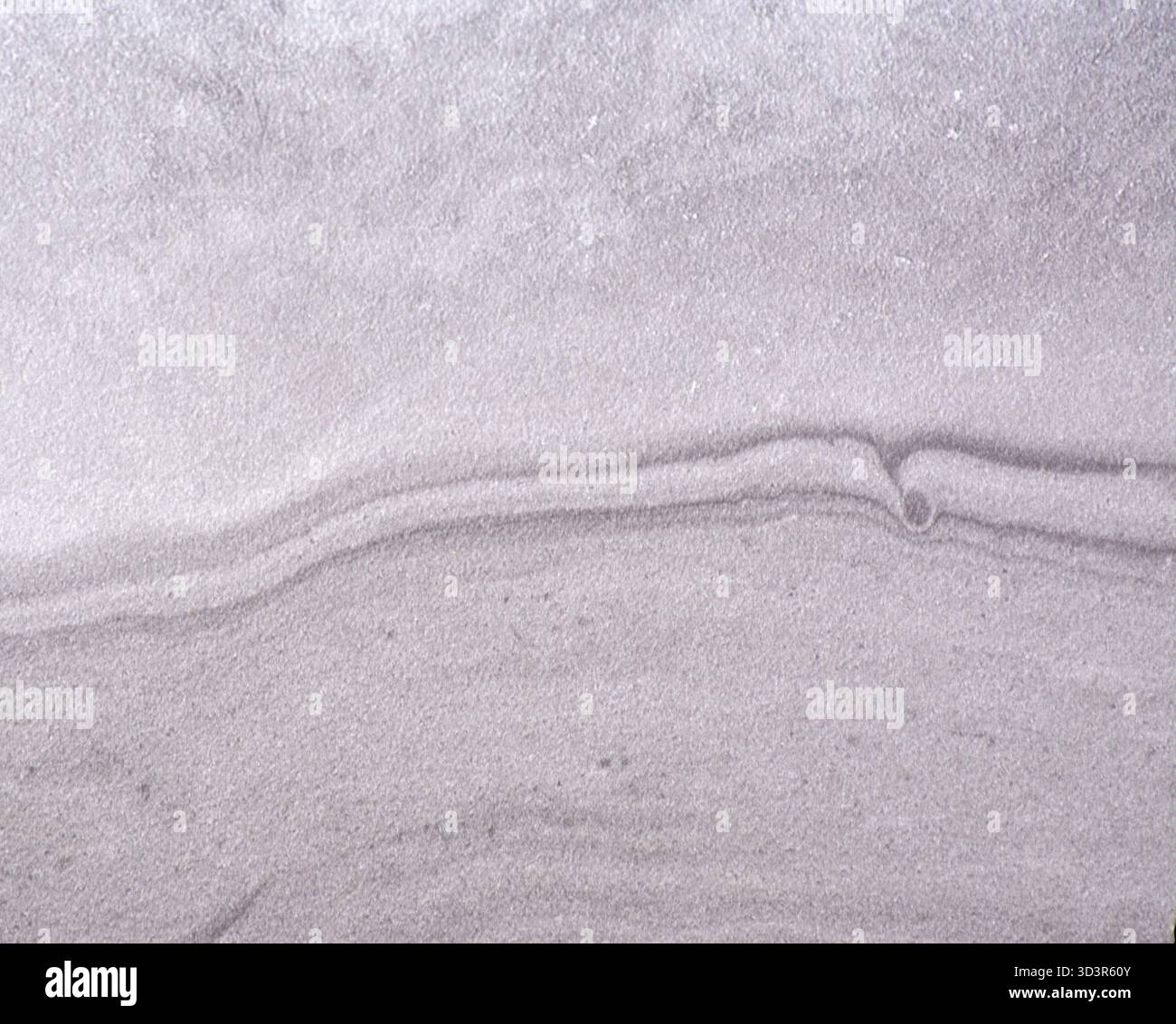 Gray marble, wavy natural stone pattern with inclusions, close-up. Seamless background texture. Stock Photo