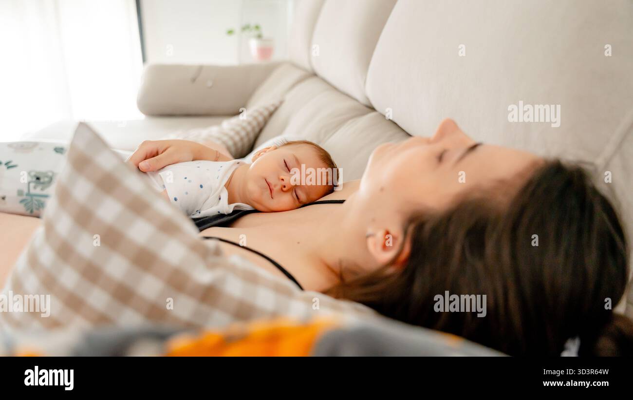 A heartwarming scene of a three-month-old baby peacefully napping on a ...