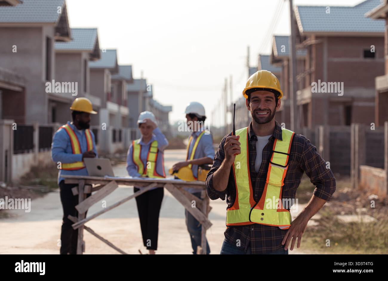 Portrait of engineers work together to assess the residential home ...