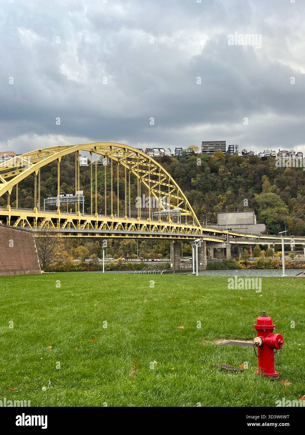 Yellow steel bridge and hillside view in Pittsburgh, Pennsylvania - Smartphone Captured Stock Image