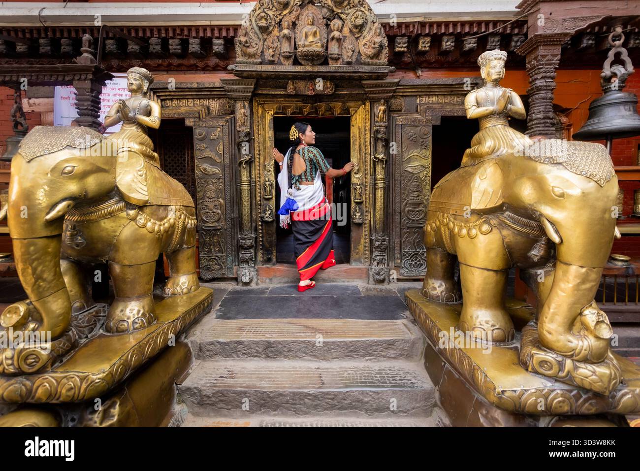 Newari Girl in Traditional Attire at the Golden Temple Patan Durbar Square Stock Photo