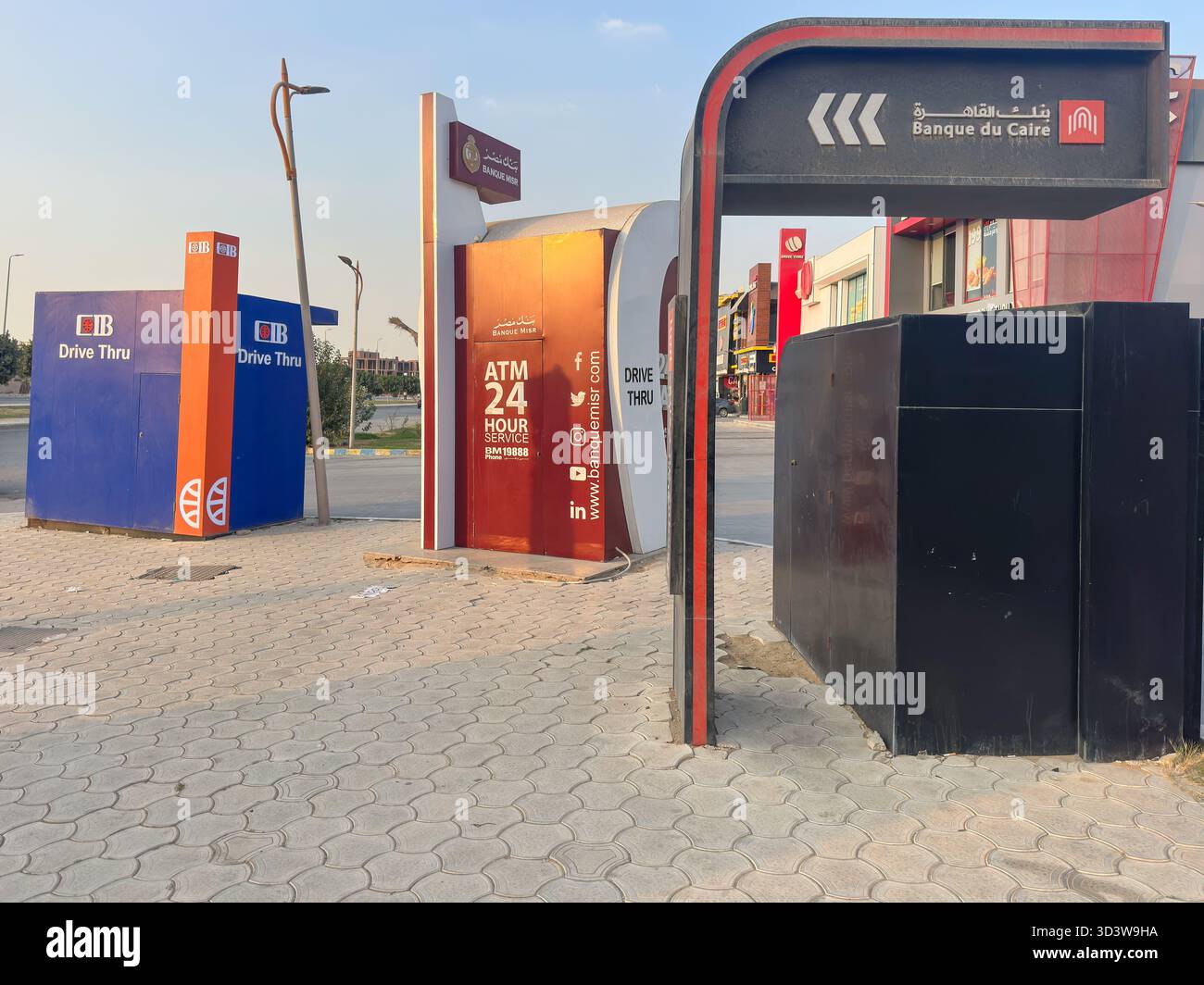 Drive thru ATM cashpoints of Banque du Caire BDC Commerical International Bank CIB and Banque Misr at a gas station in Cairo, Egypt - Smartphone Captured Stock Image