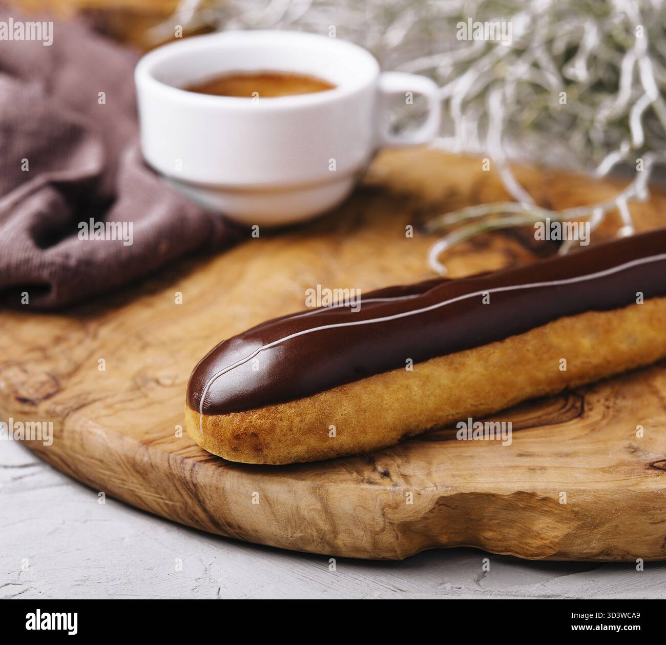 Food, Eclairs with chocolate and a coffee cup Stock Photo