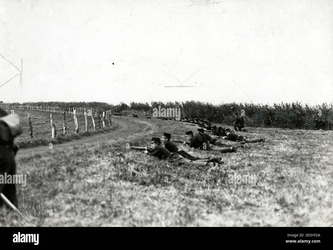 Dutch Army soldiers during maneuvers in 1912, seeking cover behind a ...