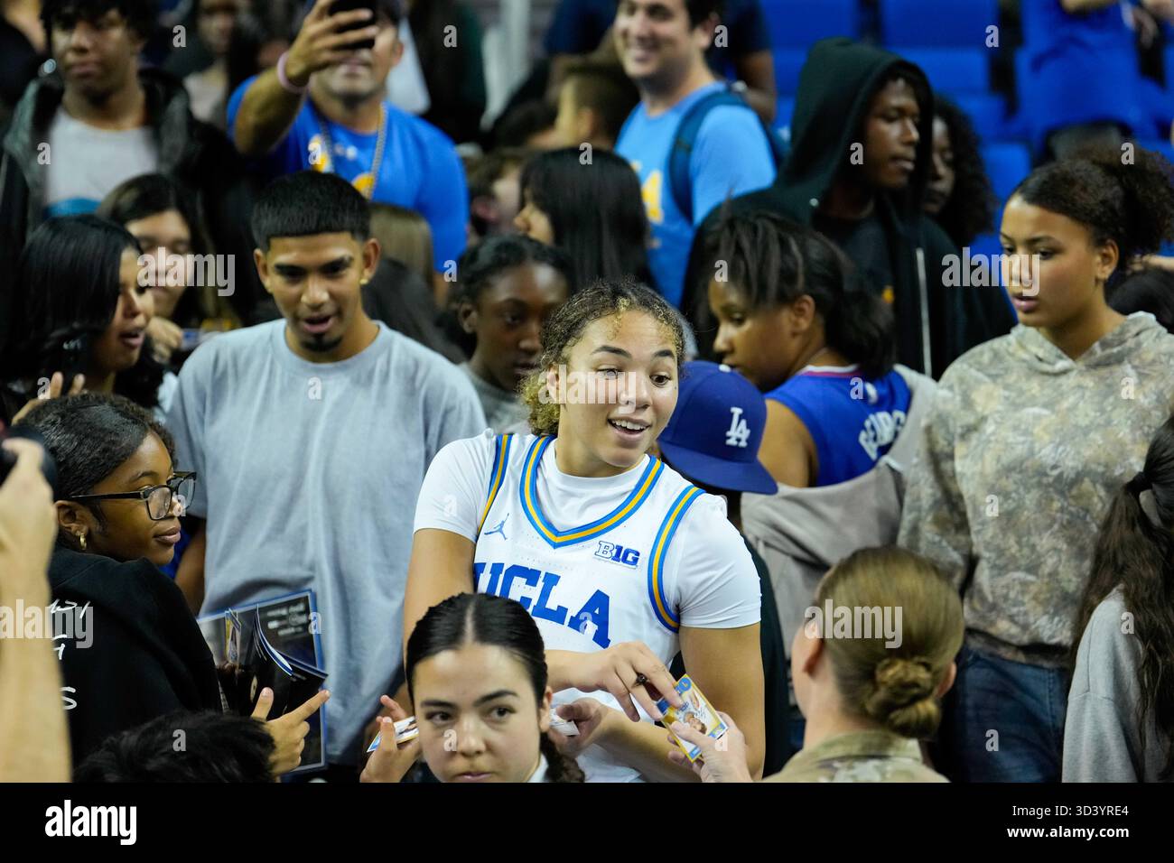 UCLA Bruins guard Kiki Rice (1) signs autographs after an NCAA ...